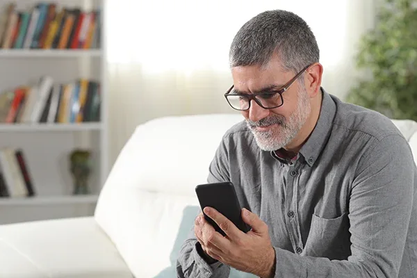 A person using a phone to track progress
